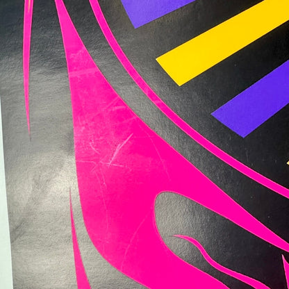 Close-up of light scratches to one section of poster. 