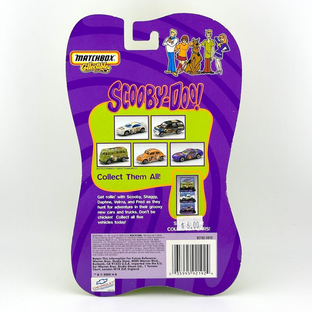 Back of a Matchbox Collectibles Scooby-Doo! toy package, featuring purple & lime green graphics with character illustrations.