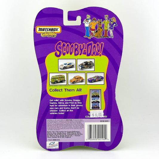Back of a Matchbox Collectibles Scooby-Doo! toy package, featuring purple & lime green graphics with character illustrations.
