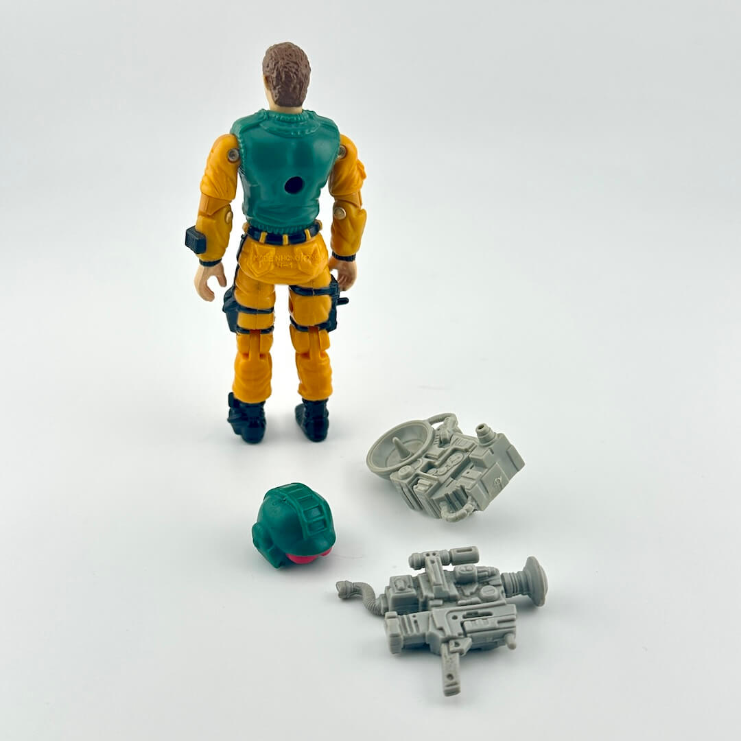 G.I. Joe action figure with accessories and character card against white background.