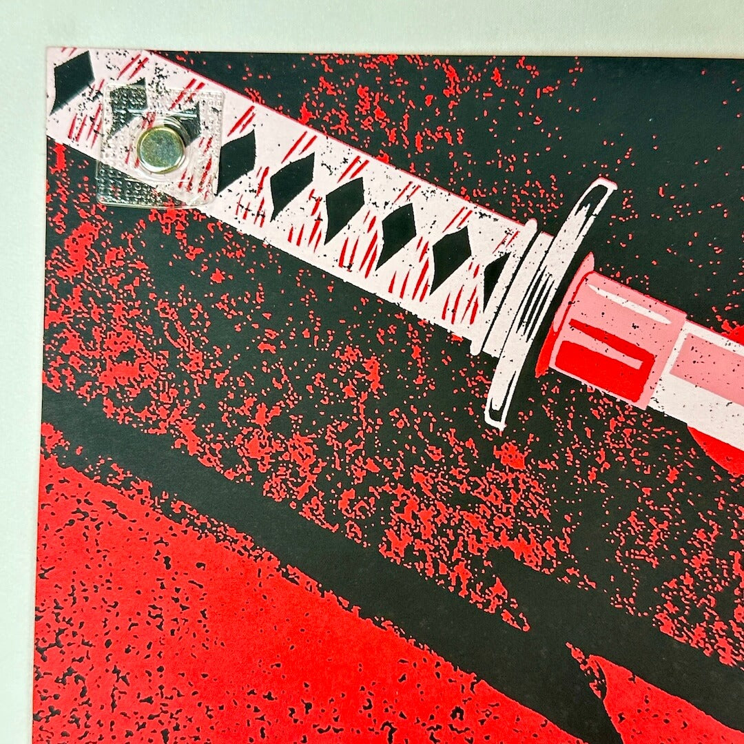 Sword with red and black pattern on a textured background