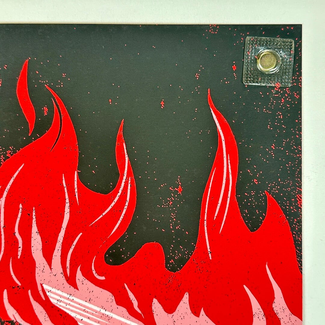 Red flames on a black background with a small square object in the corner.