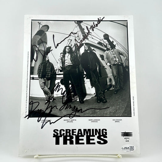 Autographed photo of a band with 'Screaming Trees' at the bottom on a white background