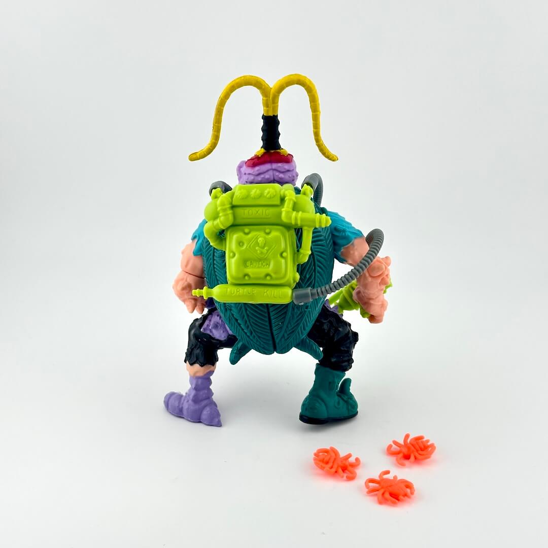 TMNT action figure with accessories on white background. 