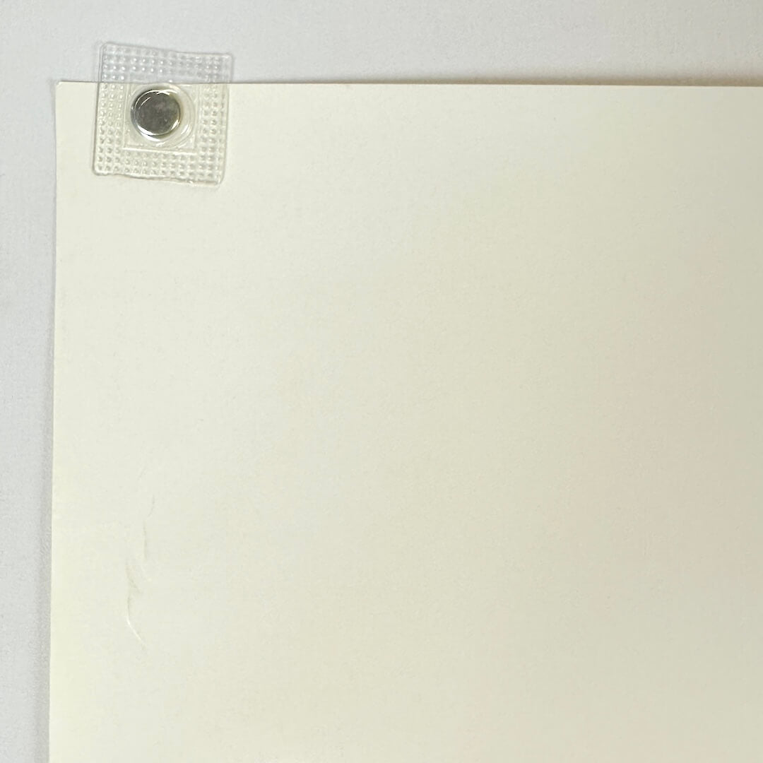 Top left corner with some wear to one edge.