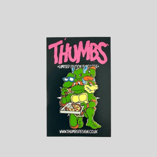 TMNT Michaelangelo eating pizza with 4 other cartoon turtle heads: Filburt, Franklin, Wario, & a Pokemon. 