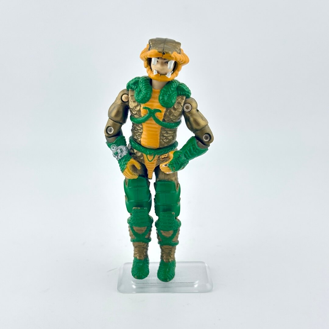 Action figure with green and yellow costume on a white background