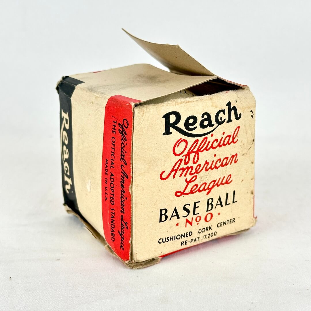 Vintage Reach Official American League Baseball No. 90 box packaging, showing a worn tan cardboard box.
