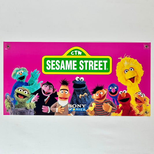 Sesame Street banner with characters on a pink background