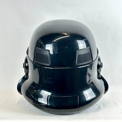 Glossy black Stormtrooper helmet photographed from the back on light background. 