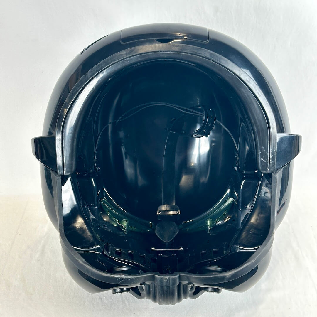 Glossy black stormtrooper helmet interior view showing adjustable straps for wearing. 