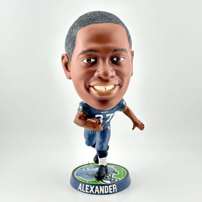 Bobblehead figure of a football player in a blue uniform with a white background