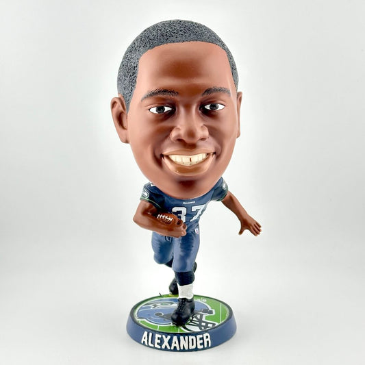 Bobblehead figure of a football player in a blue uniform with a white background