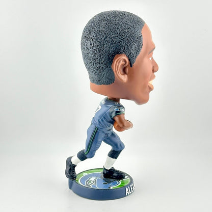 Bobblehead figure of a sports player in a blue uniform on a white background