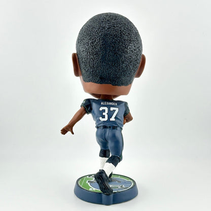 Bobblehead figure of a sports player in a blue uniform on a white background