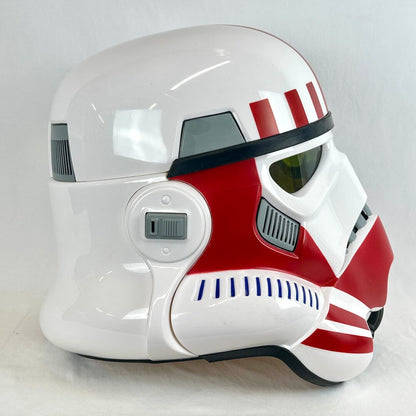 A white and red stormtrooper-style helmet with black trim. 
