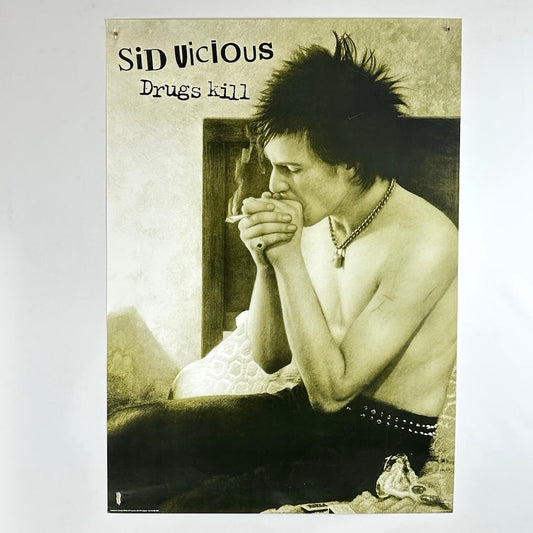 Vintage-style poster with a person sitting on a bed, smoking a cigarette, and text 'Sid Vicious Drugs kill' on a textured background.
