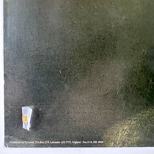 Bottom left corner of poster with publishing information and slight damage to corner. 