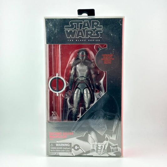 Star Wars action figure in its original retail packaging with window showing all black figure. 