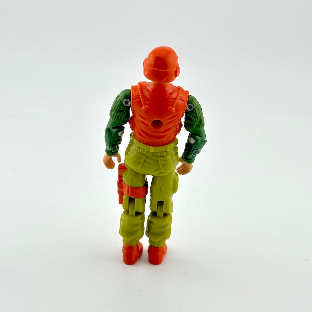 Toy figure with green and orange outfit on a white background