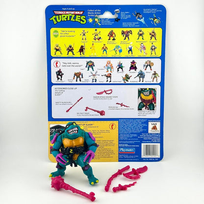 TMNT turtle action figure with accessories and card back on white background.