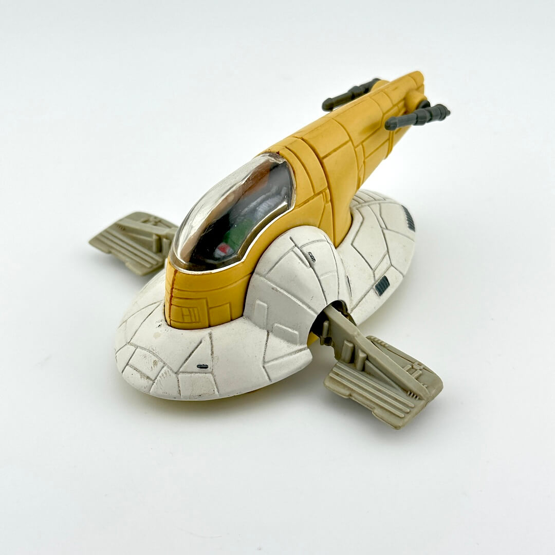 Diecast model of a spaceship of Boba Fett's Slave 1 on a white background