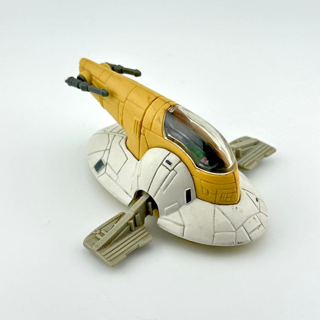 Diecast model of a spaceship of Boba Fett's Slave 1 on a white background