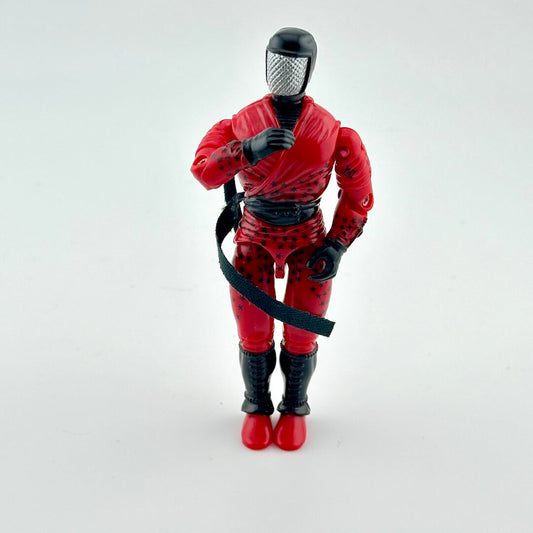Action figure in red and black outfit on a white background