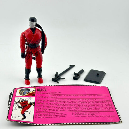 Action figure in red and black costume with accessories and character card on a white background