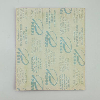Backside of concert pass showing backing intact, against white background. 