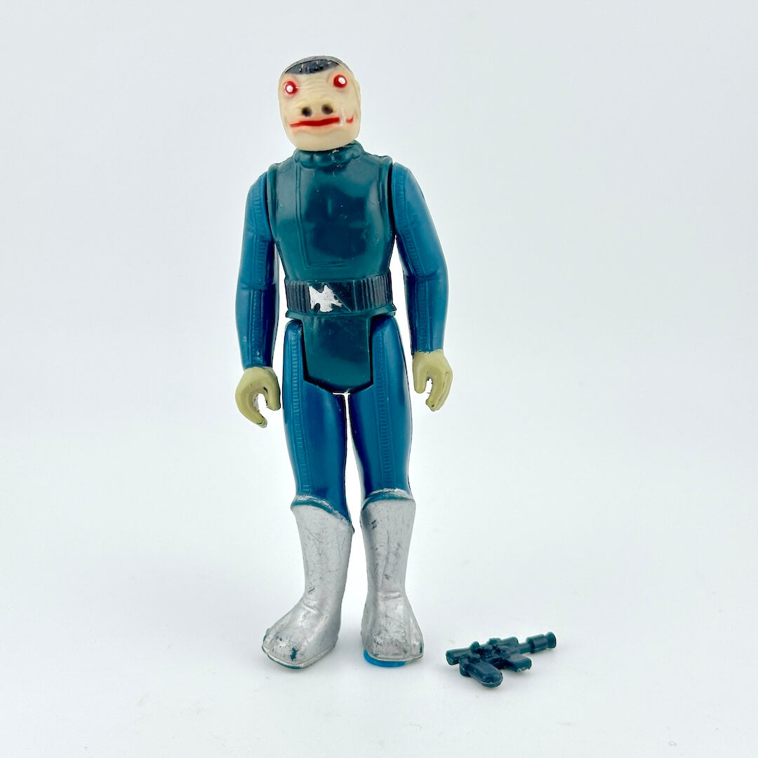 Vintage action figure in a blue suit with a white background