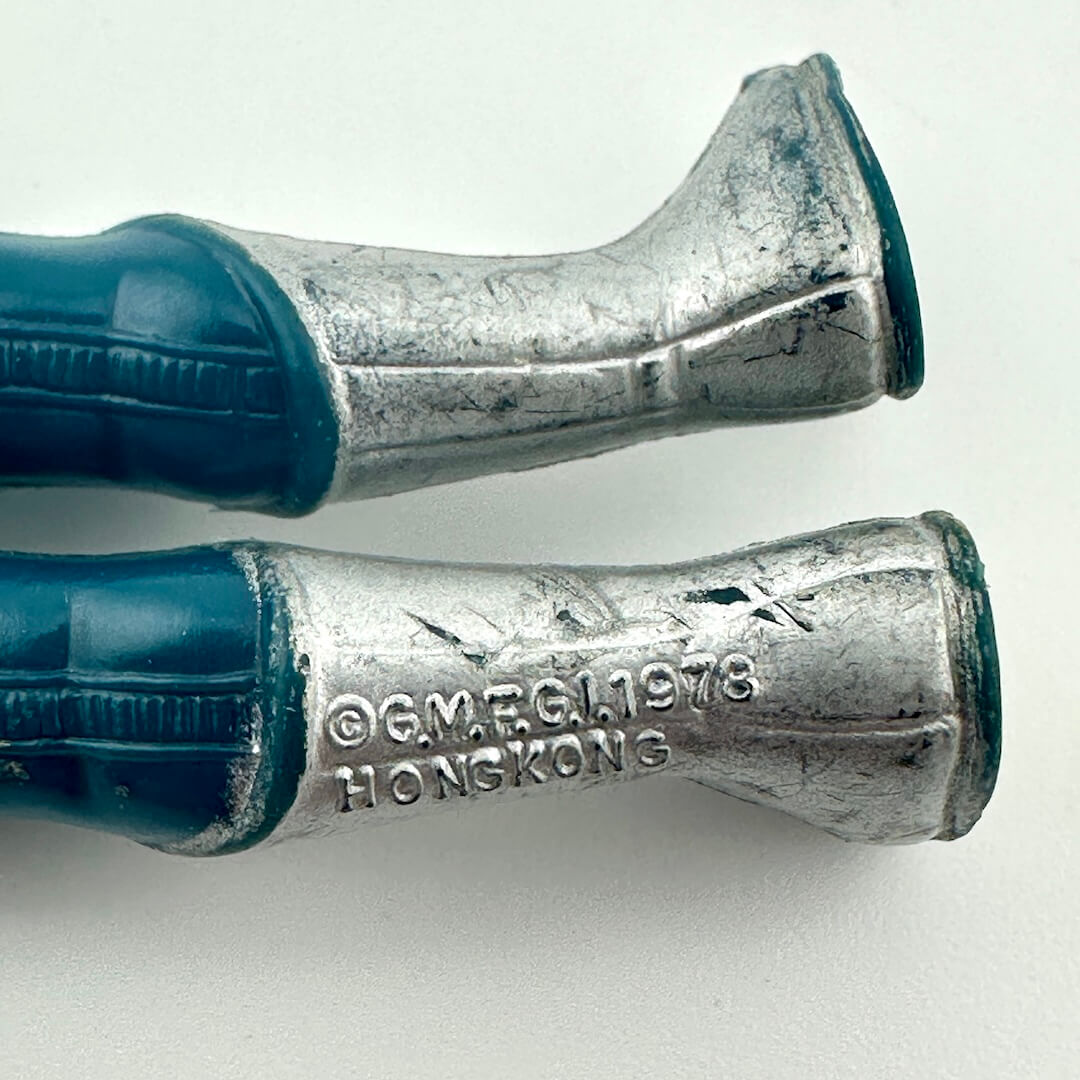 Close-up of figure's legs to show COO and copyright information. 