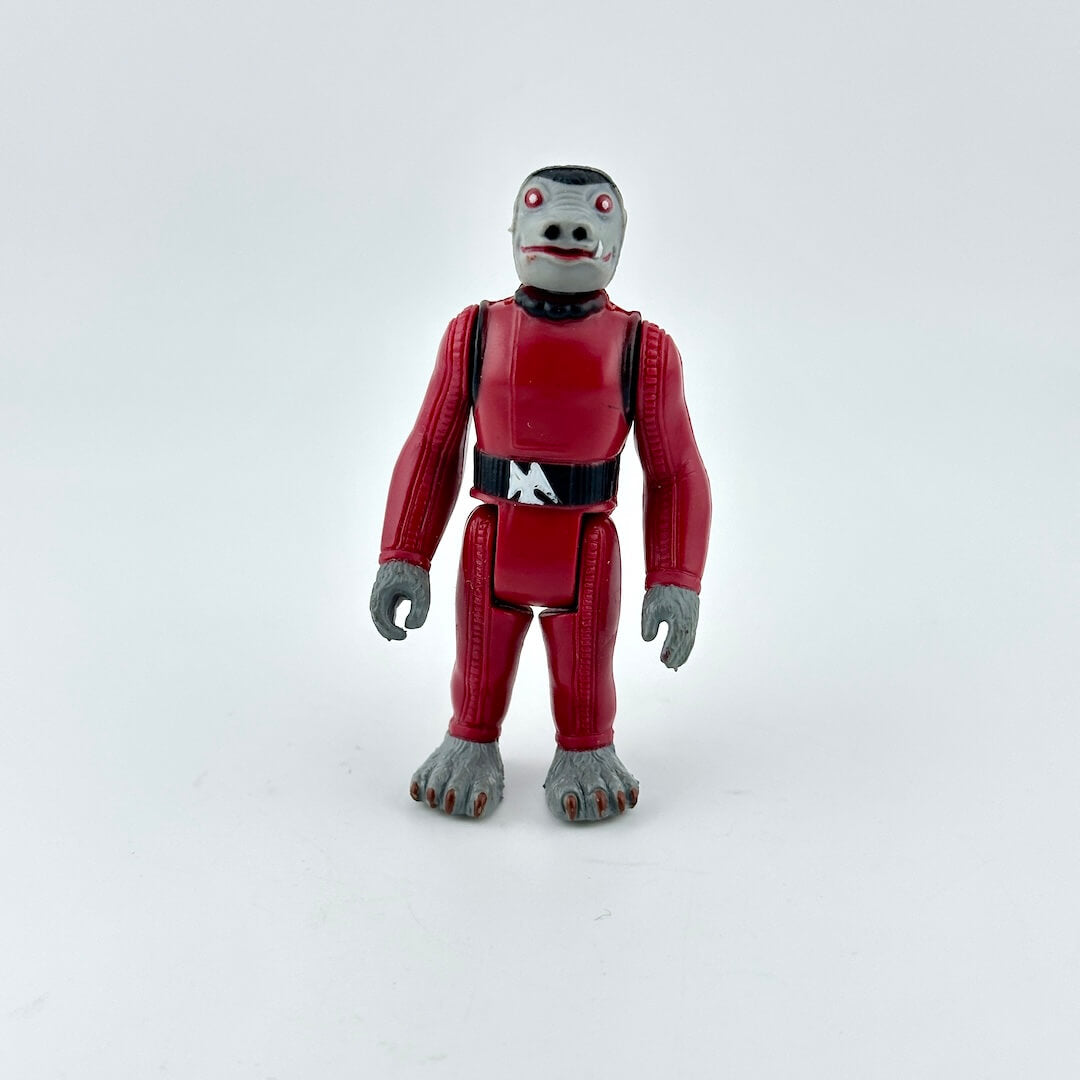 Action figure with red suit and gray limbs on a white background