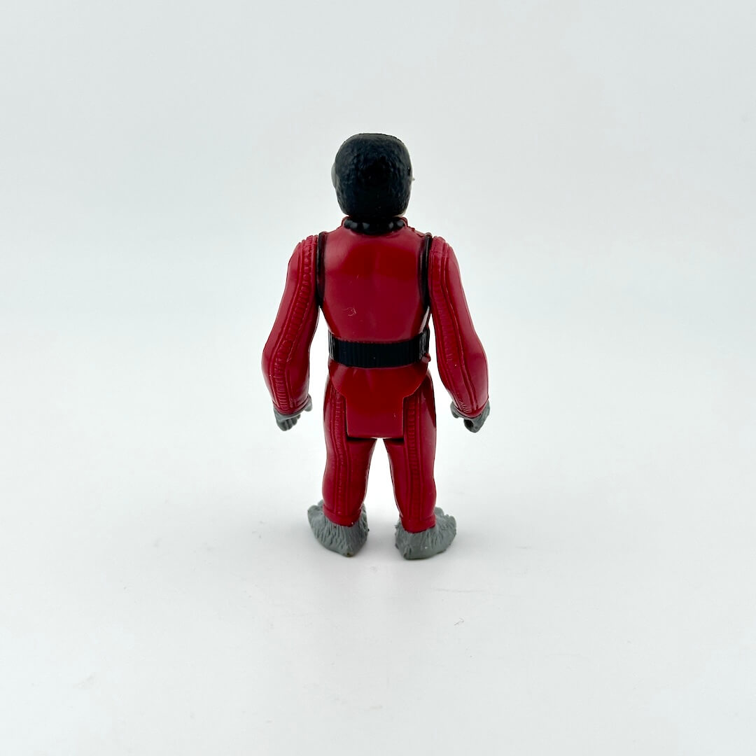 Action figure in a red suit with black hair on a white background