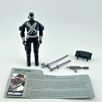 G.I. Joe action figure with accessories and card on a white background