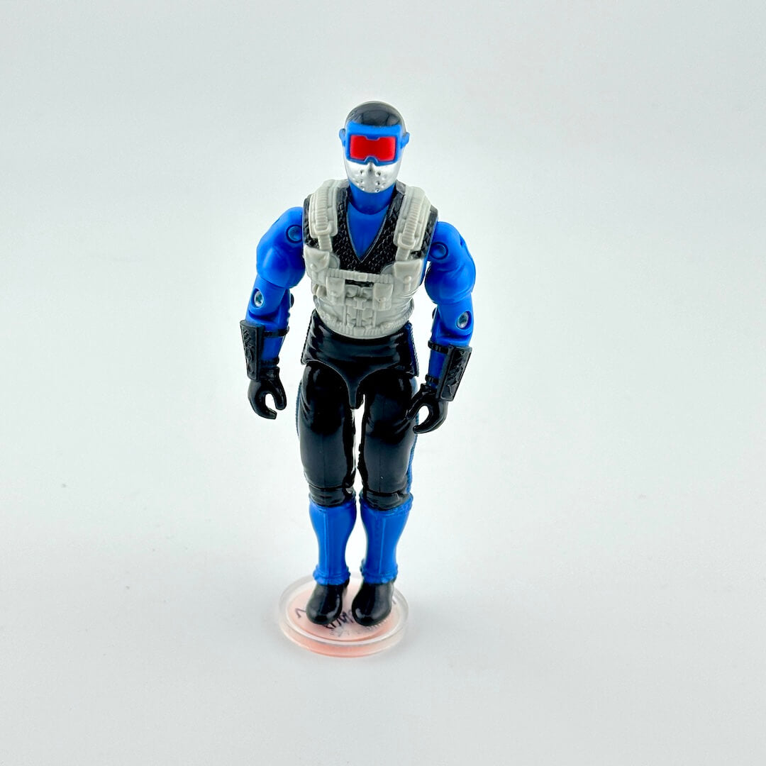 Action figure with blue and black outfit on a white background