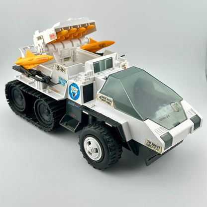 Toy vehicle with rocket launchers on a gray background