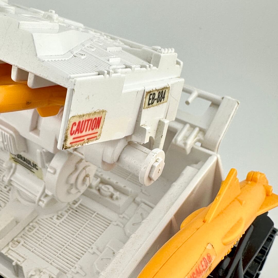 Close up of broken hinge on missile box. 