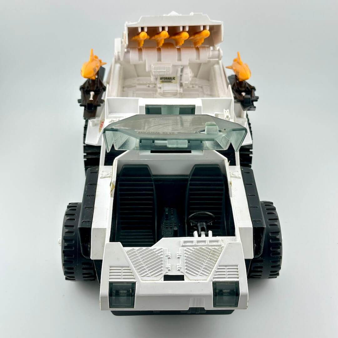 Front view of vehicle with windshield open to show cockpit. 