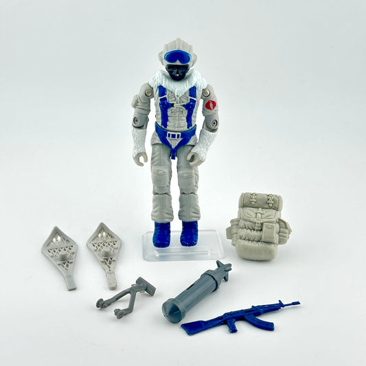 GI Joe action figure with accessories against white background. 
