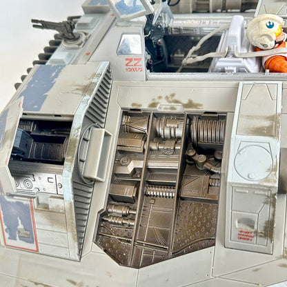 Close-up of a detailed model vehicle interior, showing weathered gray and silver panels, mechanical details.