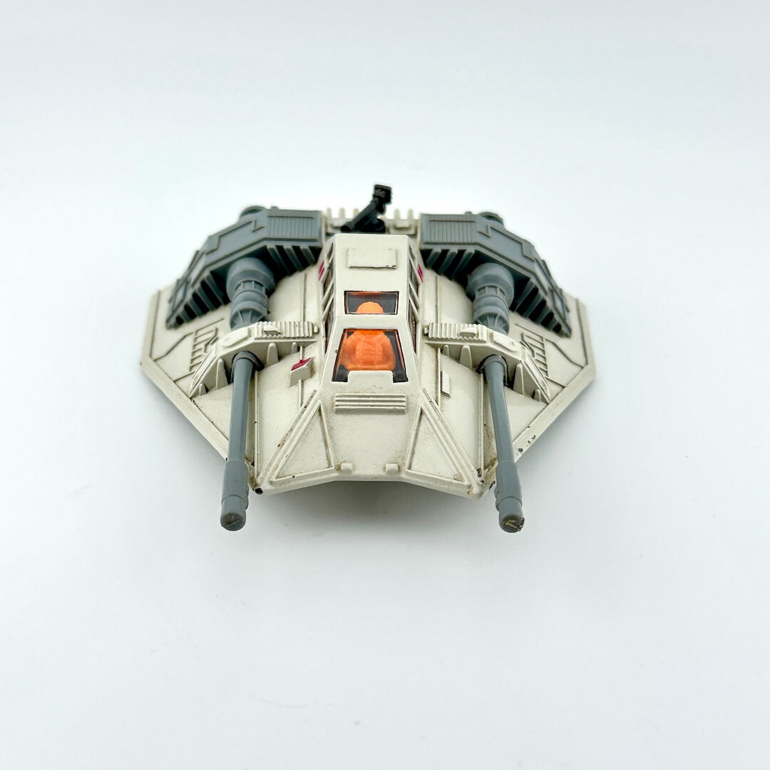 Diecast model of a Star Wars' Snowspeeder on a white background