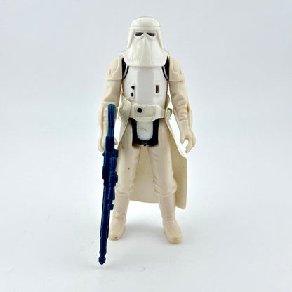 Action figure in a white costume with a blue weapon on a light gray background