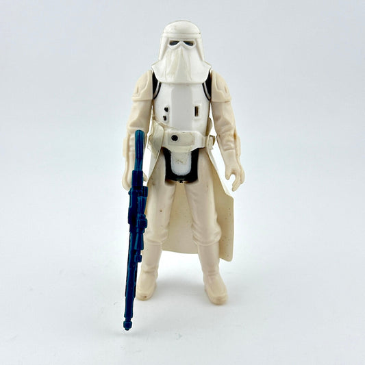 Action figure in a white costume with a blue weapon on a light gray background
