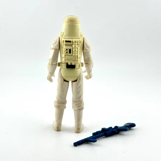 Action figure in a beige suit with a blue weapon on a white background