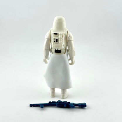 A vintage white snowtrooper action figure shown from the back, featuring a detailed back panel and a blue blaster accessory.