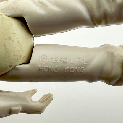 Close-up of a sculpture with '1980 L.F.L. Hong Kong' branding on a white background