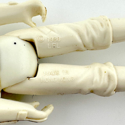 Close-up of back of figure's legs to show COO and copyright information. 