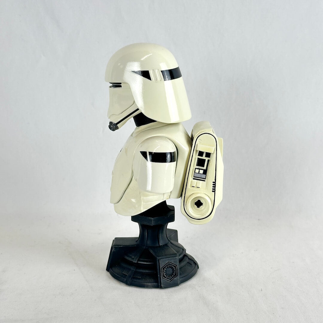 A collectible bust of a Star Wars First Order Stormtrooper, mounted on a black display stand.