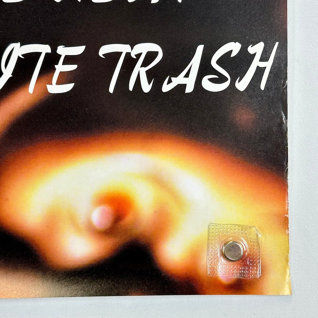 Bottom right corner with wear to right edge. 